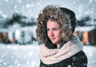 Beautfiful Woman in Winter Snowfall - Just Colorful Stock Photos and Animations for all your Projects.